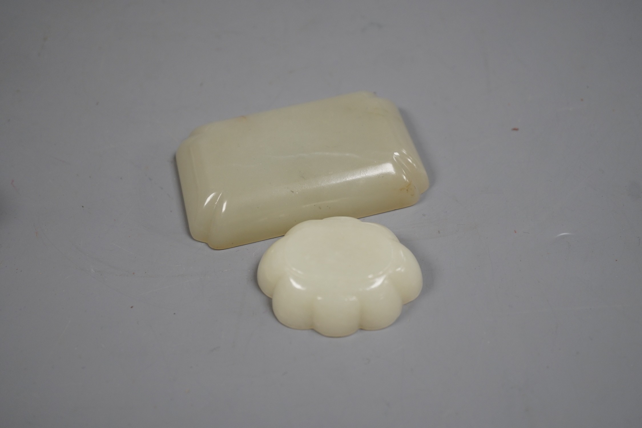 Two Chinese pale celadon jade brushwashers, largest 8 cm